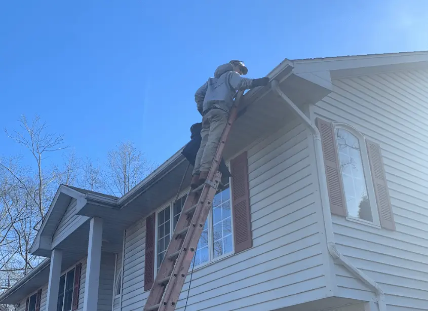 Gutter cleaning and maintenance being performed by Middleburg Heights Power Washing in Middleburg Heights